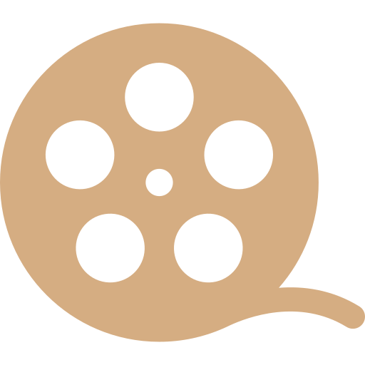 Tan film reel icon with four circular holes on a white background.